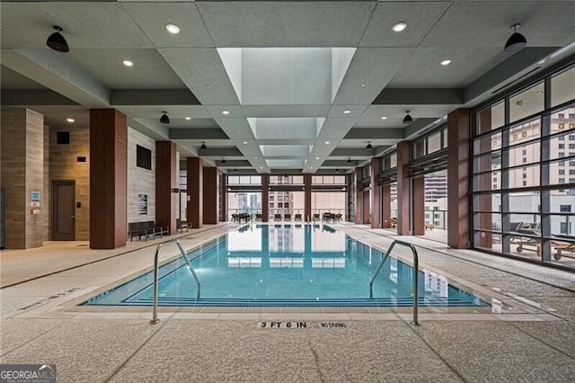 view of swimming pool featuring elevator