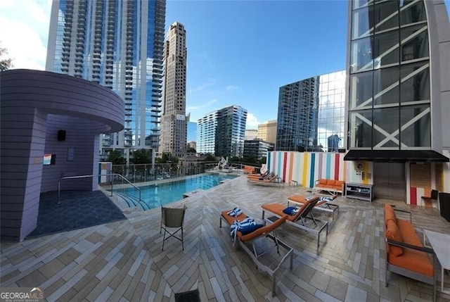 view of swimming pool with a patio