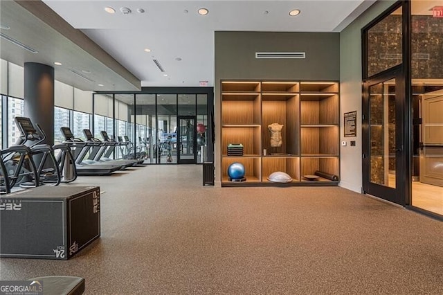 workout area with floor to ceiling windows