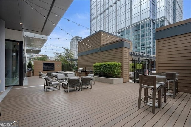 deck featuring outdoor lounge area