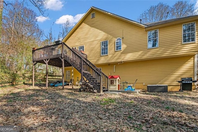 rear view of property with a deck