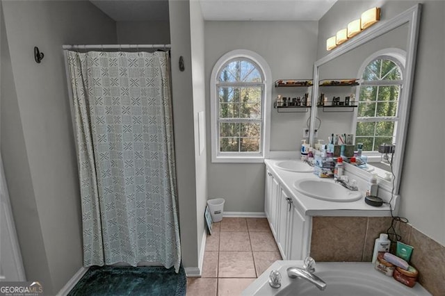 bathroom featuring tile patterned floors, vanity, and shower with separate bathtub