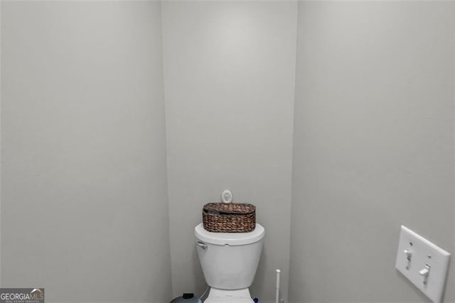 bathroom featuring toilet