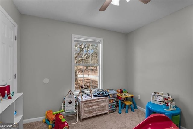 recreation room featuring carpet and ceiling fan