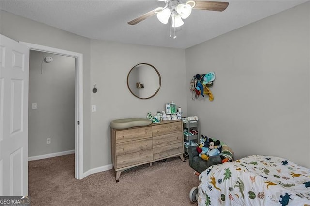 bedroom with light carpet and ceiling fan