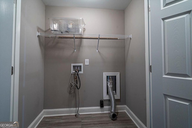 clothes washing area featuring hookup for a washing machine, hookup for an electric dryer, laundry area, wood finished floors, and baseboards