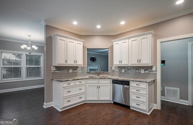 kitchen featuring visible vents, stainless steel dishwasher, white cabinets, a sink, and baseboards