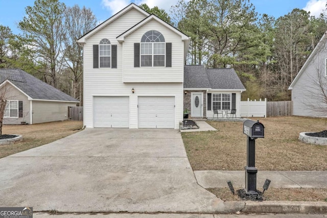 view of front property featuring a garage and a front lawn