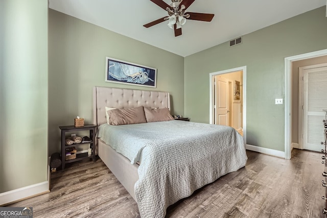 bedroom with hardwood / wood-style flooring and ceiling fan