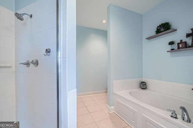 bathroom with tile patterned floors and independent shower and bath