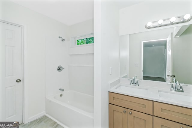 bathroom with vanity and bathtub / shower combination