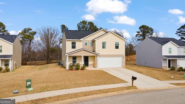 front facade featuring a garage, a front yard, and a porch