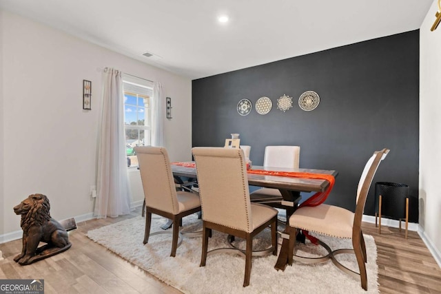 dining room with light hardwood / wood-style flooring