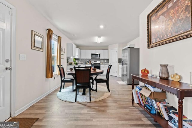 dining room with light hardwood / wood-style floors