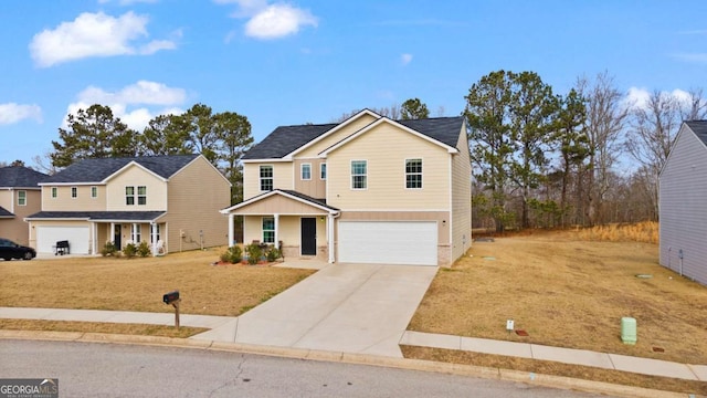 view of property with a porch, a garage, and a front lawn