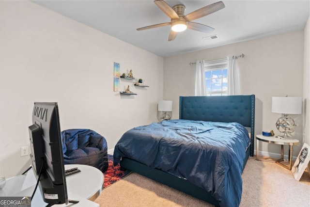 carpeted bedroom with ceiling fan