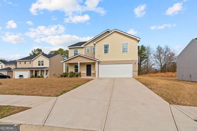 view of property with a garage, a front lawn, and covered porch