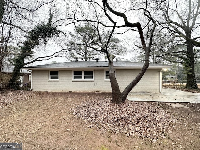 view of property exterior featuring a patio area