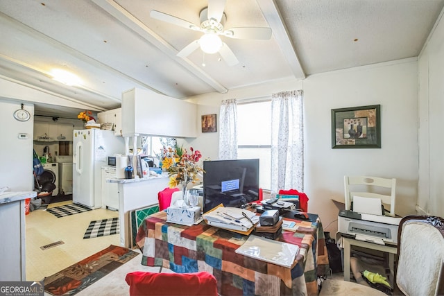 office space with beamed ceiling, ceiling fan, and separate washer and dryer