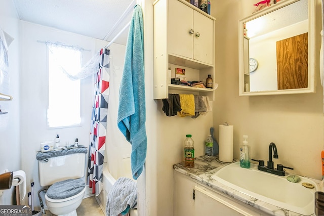 full bathroom featuring vanity, toilet, and shower / tub combo