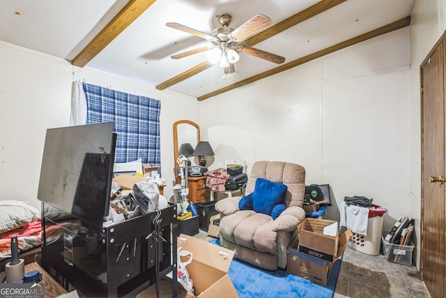 interior space with beam ceiling and ceiling fan