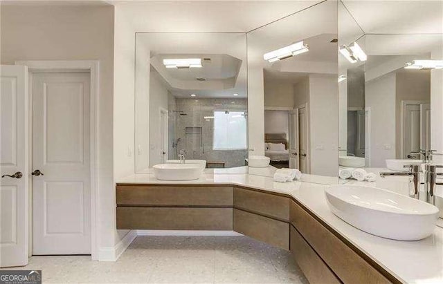 bathroom with vanity, tile patterned floors, and walk in shower