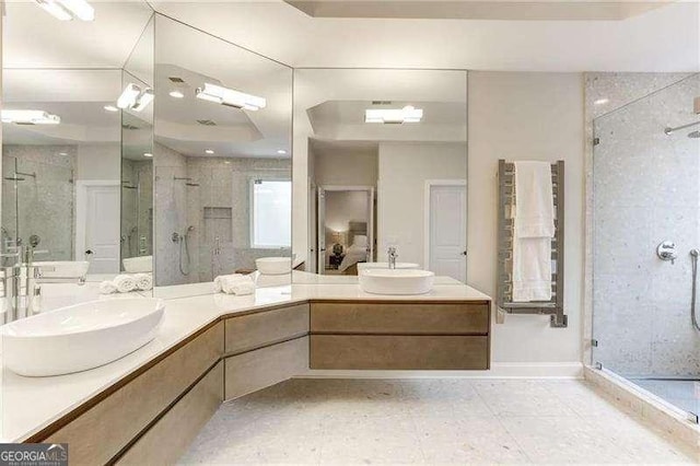 bathroom featuring vanity and a shower with door