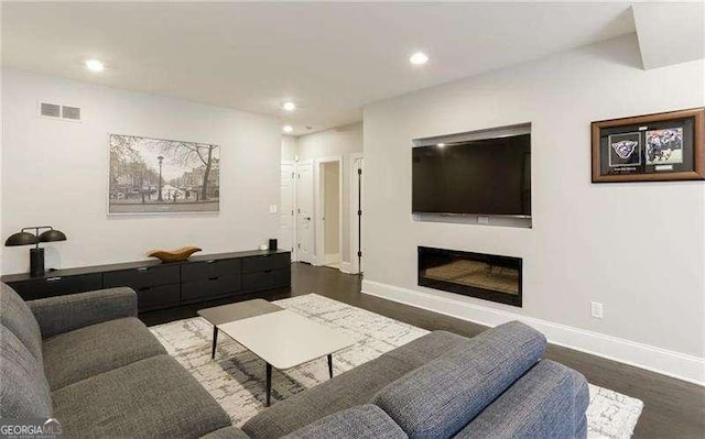 living room featuring dark hardwood / wood-style floors