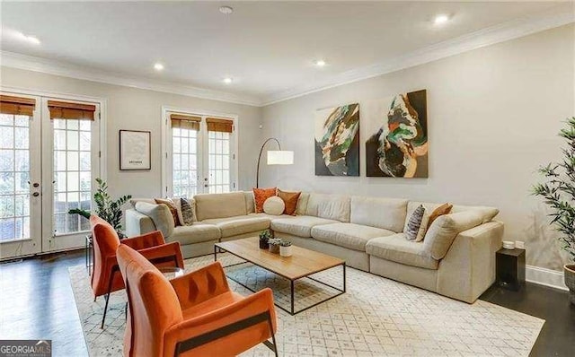 living room with wood-type flooring, ornamental molding, and french doors