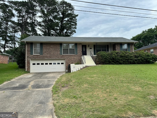 view of front of property featuring a garage and a front lawn