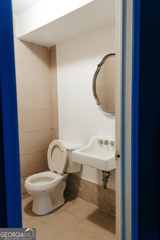 bathroom with sink, tile patterned floors, and toilet