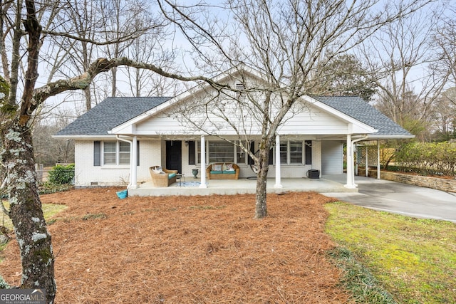 view of front facade with a carport and covered porch