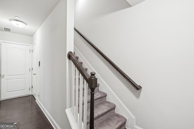 stairway featuring hardwood / wood-style flooring