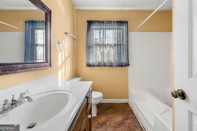 full bathroom featuring vanity, shower / tub combination, and toilet