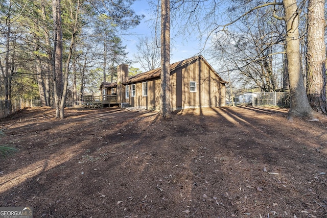 view of side of property with a deck