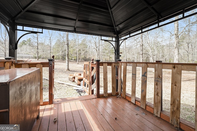 wooden terrace featuring a gazebo