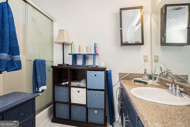 full bath with marble finish floor and vanity