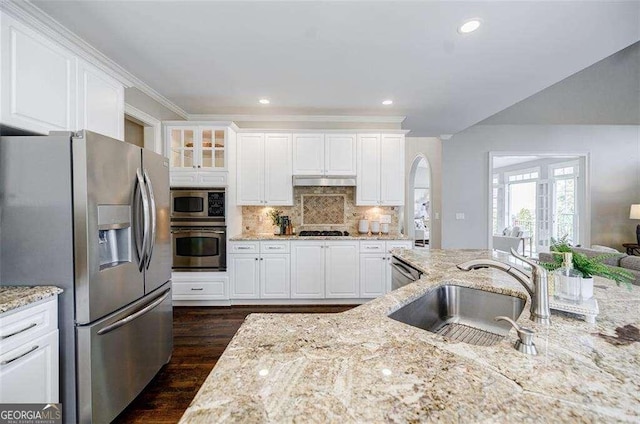 kitchen featuring sink, light stone countertops, white cabinets, and appliances with stainless steel finishes