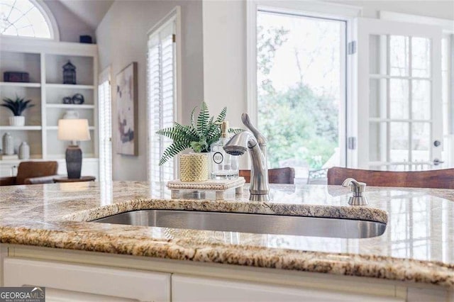 interior details with sink and light stone counters