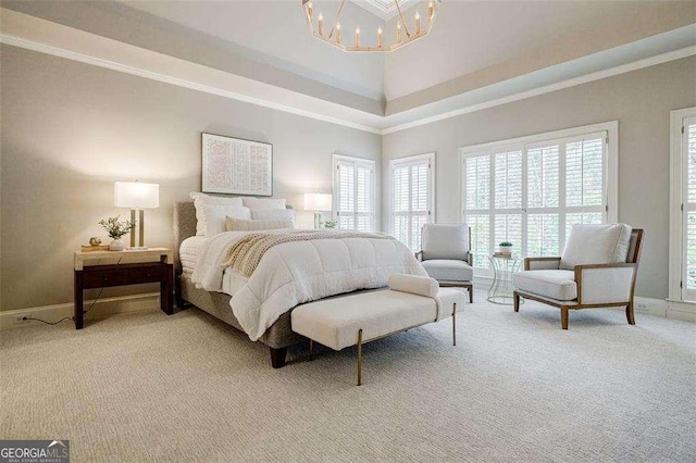 carpeted bedroom featuring ornamental molding and a chandelier