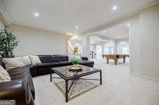 carpeted living room featuring crown molding and pool table