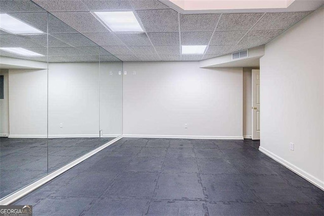 unfurnished room with a paneled ceiling