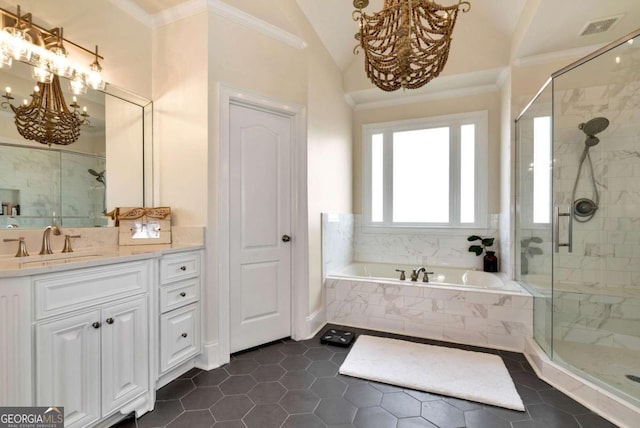 bathroom with lofted ceiling, crown molding, an inviting chandelier, vanity, and separate shower and tub