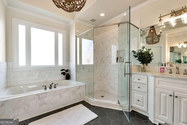 bathroom with a notable chandelier, ornamental molding, and plus walk in shower