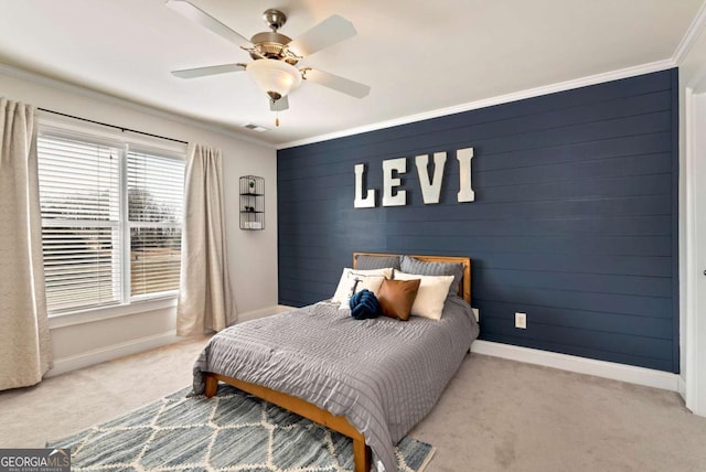 bedroom featuring crown molding, ceiling fan, and light carpet