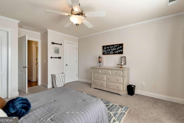 carpeted bedroom featuring crown molding and ceiling fan