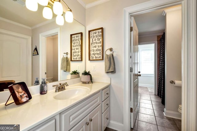 bathroom with vanity, crown molding, a chandelier, and toilet