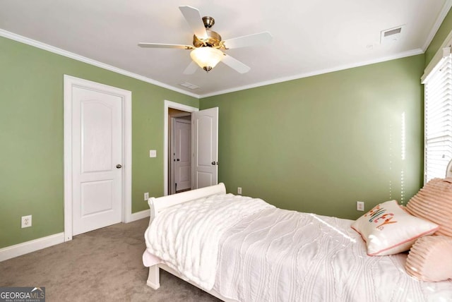 bedroom featuring crown molding, ceiling fan, and carpet flooring