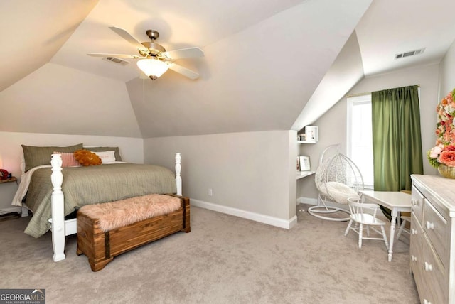 carpeted bedroom with ceiling fan and lofted ceiling