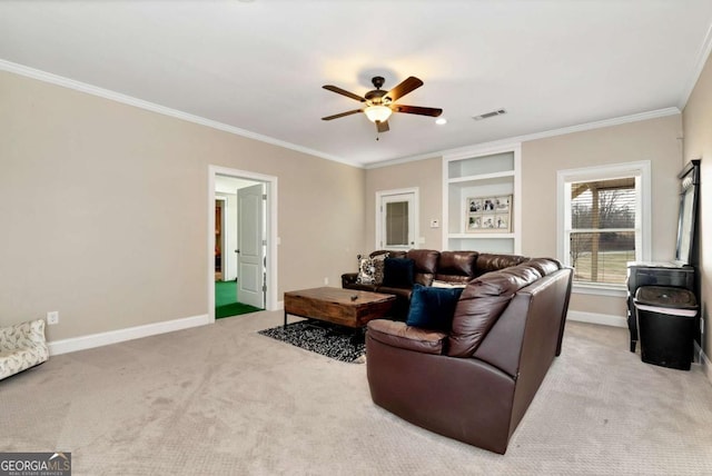 living room with light colored carpet, ornamental molding, and ceiling fan